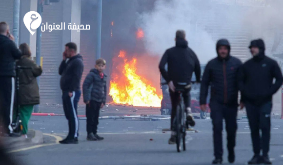 اضطرابات في بلفاست على خلفية حادثة طعن ومشتبه به "مهاجر" 4 اضطرابات في بلفاست على خلفية حادثة طعن ومشتبه به "مهاجر" - psd elenwan 2026 06 10T130156.926